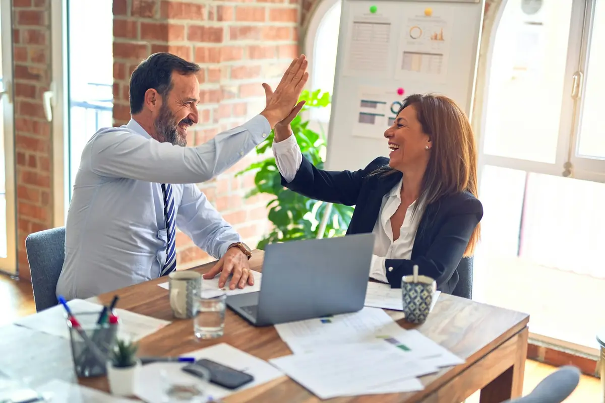 Employer and candidate celebrating a successful match